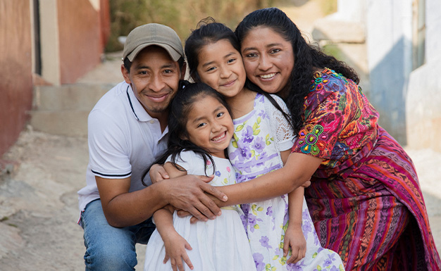 Portrait of a family hugging in a rural area